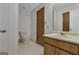 This is a clean bathroom with classic fixtures, and a wood-trimmed vanity at 390 Stoneridge Way, Fayetteville, GA 30215