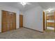 Bedroom features neutral walls, carpet floors, and a window at 390 Stoneridge Way, Fayetteville, GA 30215