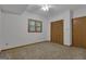 Bedroom features neutral walls, carpet floors, and a window at 390 Stoneridge Way, Fayetteville, GA 30215