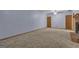 Spacious living room featuring carpeted floors, ceiling fan, and a charming brick fireplace at 390 Stoneridge Way, Fayetteville, GA 30215