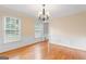 Bright dining room with hardwood floors, wainscoting, and ample natural light at 829 Bev Ct, Lawrenceville, GA 30046
