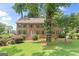 Charming brick home featuring a well-manicured lawn and vibrant green shutters at 829 Bev Ct, Lawrenceville, GA 30046
