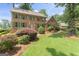 Charming brick home featuring a well-manicured lawn and vibrant green shutters at 829 Bev Ct, Lawrenceville, GA 30046