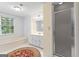 Bathroom features a soaking tub, a shower, and a vanity with storage space at 829 Bev Ct, Lawrenceville, GA 30046