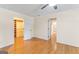 Bright main bedroom boasts hardwood floors, ceiling fan, and access to a walk-in closet at 829 Bev Ct, Lawrenceville, GA 30046