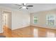 Comfortable main bedroom showcasing hardwood floors and double windows offering natural light at 829 Bev Ct, Lawrenceville, GA 30046