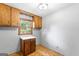 Pantry with wood cabinets, hardwood floors, and plenty of storage space at 829 Bev Ct, Lawrenceville, GA 30046