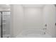 Bathroom features a soaking tub with a walk-in shower to the side at 8587 Secretariat Dr, Lithonia, GA 30058