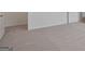Neutral bedroom offers plush carpet and white trim and painted walls at 8587 Secretariat Dr, Lithonia, GA 30058