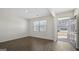 A bright, airy entryway showcases pristine hardwood floors, neutral walls, and an abundance of natural light at 8587 Secretariat Dr, Lithonia, GA 30058