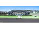 Beautiful community pool area with a covered pavilion, seating, and well-maintained landscaping at 8587 Secretariat Dr, Lithonia, GA 30058