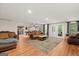 Spacious finished basement with a seating area, pool table, and access to an exercise room at 9125 Patrick Pl, Winston, GA 30187