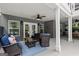 Cozy covered patio with wicker furniture, rug, and overhead ceiling fan at 9125 Patrick Pl, Winston, GA 30187