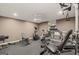 Basement exercise room with workout equipment, a ceiling fan, and rubber flooring at 9125 Patrick Pl, Winston, GA 30187
