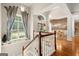 Elegant foyer with wood floors, a staircase, and natural light from large windows at 9125 Patrick Pl, Winston, GA 30187