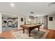 Basement game room featuring a billiards table and views to the exercise room at 9125 Patrick Pl, Winston, GA 30187