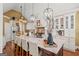Bright kitchen with stainless steel appliances, large island, and stylish lighting at 9125 Patrick Pl, Winston, GA 30187