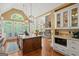 Gourmet kitchen featuring custom island, stainless appliances, and natural light at 9125 Patrick Pl, Winston, GA 30187