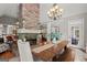 Open-concept living area with stone fireplace, hardwood floors, and adjacent formal dining room at 9125 Patrick Pl, Winston, GA 30187
