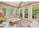 Bright sunroom with an ornate sofa and lots of natural light at 9125 Patrick Pl, Winston, GA 30187