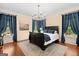 Main bedroom with a traditional chandelier, large windows and a rug at 9125 Patrick Pl, Winston, GA 30187