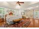 Spacious primary suite with hardwood flooring, a sitting area, and lots of natural light at 9125 Patrick Pl, Winston, GA 30187