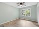 Serene bedroom with fresh paint, new floors, and a large window offering ample natural light at 260 Pinehurst Dr, Stockbridge, GA 30281