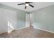 This bedroom features wood flooring, and light-green walls at 260 Pinehurst Dr, Stockbridge, GA 30281