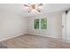 This bedroom features light walls, wood flooring, and natural light from the window at 260 Pinehurst Dr, Stockbridge, GA 30281
