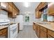 Inviting kitchen with light wood cabinets, white appliances, and a breakfast nook at 260 Pinehurst Dr, Stockbridge, GA 30281