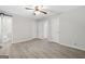 Large main bedroom with luxury vinyl plank, ceiling fan, and multiple closets at 260 Pinehurst Dr, Stockbridge, GA 30281