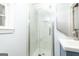 Modern bathroom with marble tiled shower, new fixtures, and glass doors at 650 Lynhurst Sw Dr, Atlanta, GA 30311