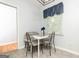 Cozy dining area with modern chairs and natural light from the window at 650 Lynhurst Sw Dr, Atlanta, GA 30311