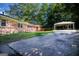 Charming brick home with a long driveway and convenient carport. Beautiful trees and landscaped yard at 650 Lynhurst Sw Dr, Atlanta, GA 30311