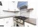 Updated kitchen featuring stainless steel gas range and designer backsplash at 650 Lynhurst Sw Dr, Atlanta, GA 30311