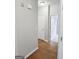 Hallway with hardwood floors that connects the home's living spaces at 537 Goldfinch Way, Stockbridge, GA 30281