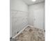 Laundry room with tile flooring, wire shelving, and utility hookups for washer and dryer at 537 Goldfinch Way, Stockbridge, GA 30281
