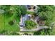 Aerial view of the property with a well-maintained lawn and mature trees at 110 Tamerlane, Peachtree City, GA 30269