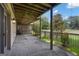 Covered back porch with lattice and a view of the backyard at 110 Tamerlane, Peachtree City, GA 30269
