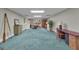 Spacious basement featuring ample lighting, carpet, and exterior access at 110 Tamerlane, Peachtree City, GA 30269