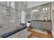 Bright bathroom featuring a glass enclosed shower, double sink vanity, and wood floors at 110 Tamerlane, Peachtree City, GA 30269