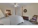 Comfortable bedroom with neutral decor, four poster bed, and natural light at 110 Tamerlane, Peachtree City, GA 30269