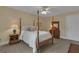 Comfortable bedroom with neutral decor, four poster bed, and natural light at 110 Tamerlane, Peachtree City, GA 30269