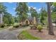 Lovely single Gathering home featuring mature trees, well manicured landscaping, and a circular driveway at 110 Tamerlane, Peachtree City, GA 30269