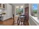 Eat-in kitchen shows glass-top table and access to screened porch at 110 Tamerlane, Peachtree City, GA 30269