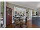 Kitchen table setup with decor and view into other areas of the house at 110 Tamerlane, Peachtree City, GA 30269