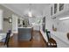 Bright kitchen featuring white cabinets, stainless steel appliances, center island, and dedicated desk area at 110 Tamerlane, Peachtree City, GA 30269