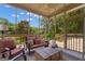 Relaxing screened porch with comfortable seating, offering serene outdoor views at 110 Tamerlane, Peachtree City, GA 30269