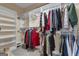 Spacious walk-in closet with custom shelving, hanging rods, and carpeted floors at 110 Tamerlane, Peachtree City, GA 30269