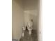 Toilet in a small, white bathroom with tiled floors at 160 Grafton St, Hampton, GA 30228